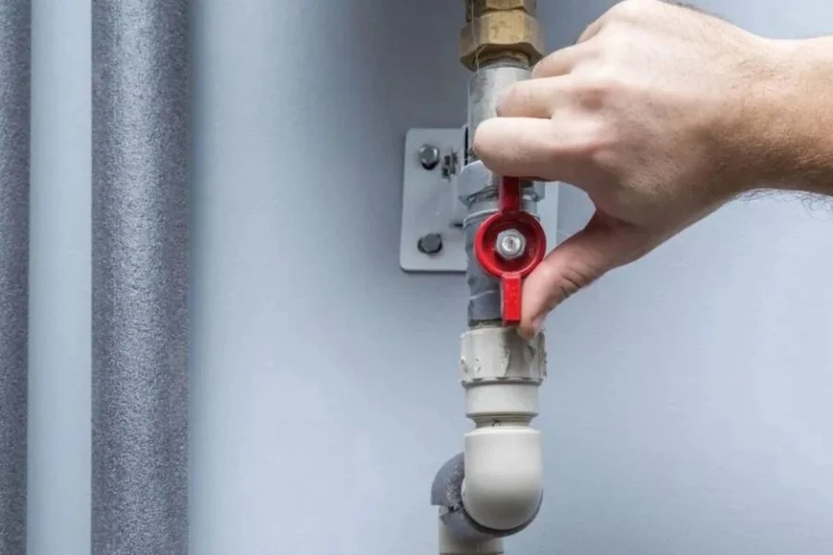 Main water shutoff valve with a tag, used to stop a burst pipe